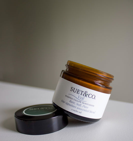 Jar of Suet & Co. product on a neutral background